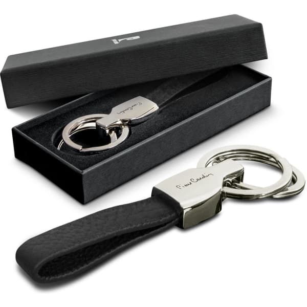 A black leather key ring with a silver clasp, presented in a black box with a velvet insert.