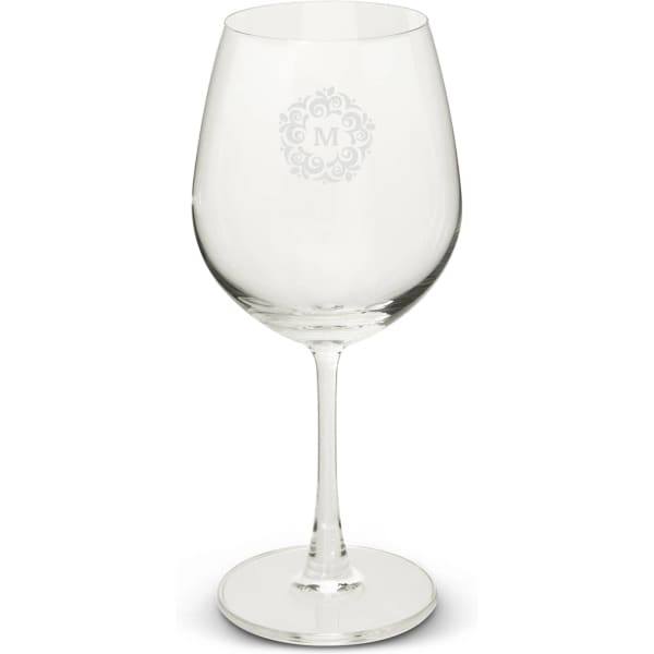 A clear wine glass with a large bowl and a slender stem, featuring a decorative logo design.