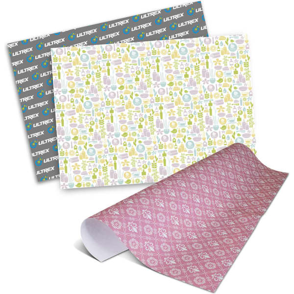 Personalised gift wrapping paper featuring colourful patterns in pink, green, and white. The image includes multiple sheets and branding.