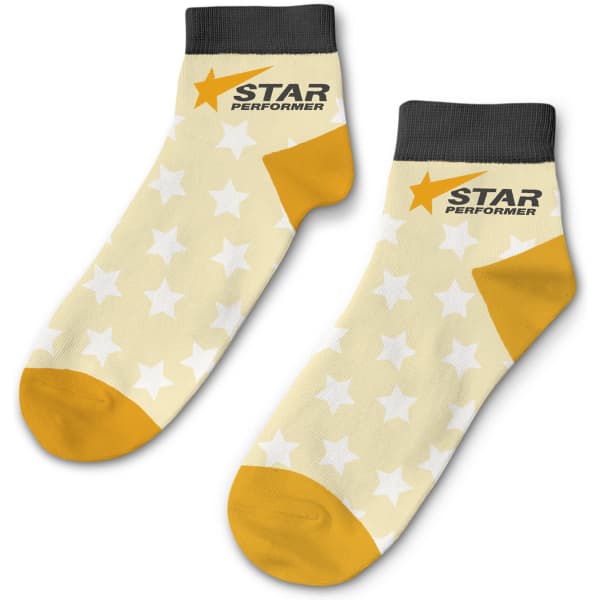 Ankle socks in light yellow with white stars and orange accents, featuring a branded logo on the side.