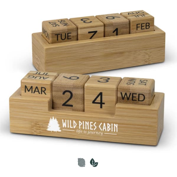 A bamboo desk calendar features wooden blocks for days and months, set on a rectangular base with a logo.