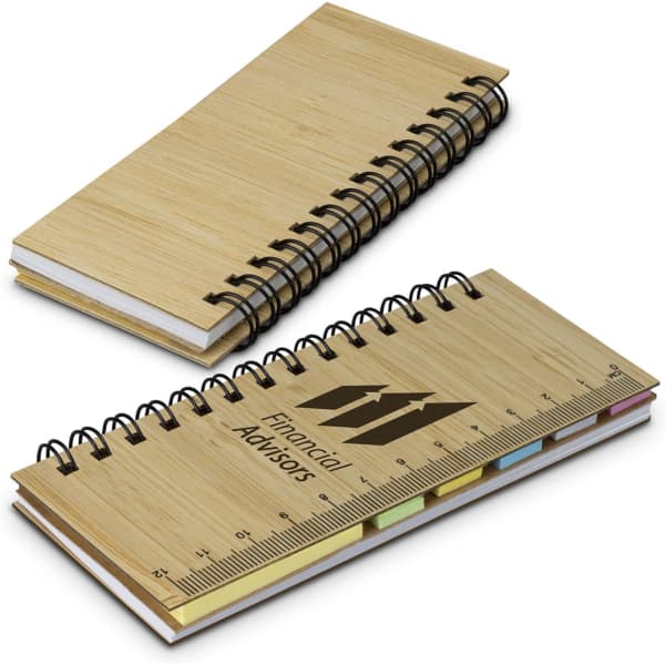 A bamboo sticky note wallet featuring a spiral binding, assorted sticky notes, and a ruler design on the cover.