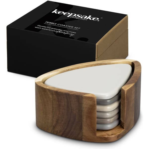 A set of five pebble-shaped coasters in grey, housed in a wooden holder, with a black box in the background.
