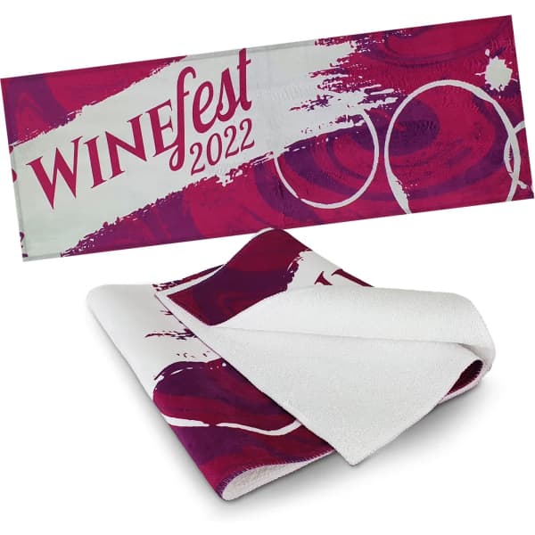 A full colour bar towel featuring a vibrant design in shades of burgundy and white, with a branding logo.