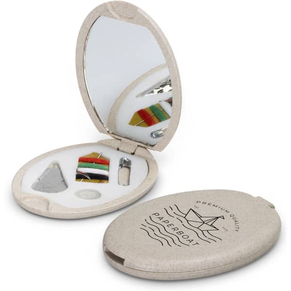 A compact sewing kit featuring a mirror, threads, needles, and accessories in a beige case with a logo.