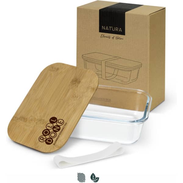 A glass lunch box with a bamboo lid and a silicone strap, presented in a brown box. It features a logo on the lid.