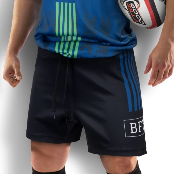 Custom men's rugby shorts in navy with green and blue stripes, featuring a logo on the leg.