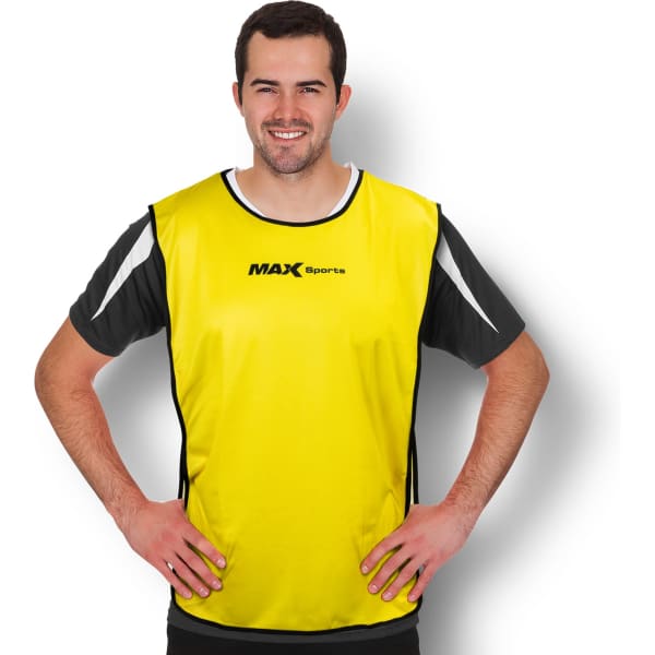 A bright yellow training bib with black and white accents, worn by a man standing with hands on hips. It features a logo.