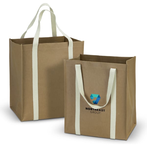 A kraft tote bag in a natural brown colour, featuring light green handles and a logo on one side.