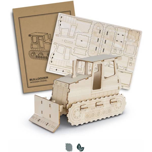 A wooden model of a bulldozer in natural wood colour, accompanied by a set of pre-cut assembly sheets.