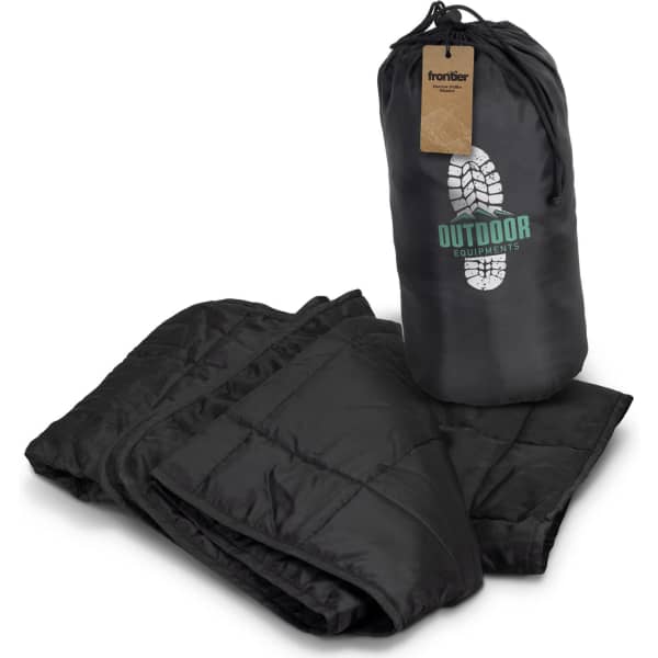 A black puffer blanket with a carrying bag, featuring a logo and a quilted design.