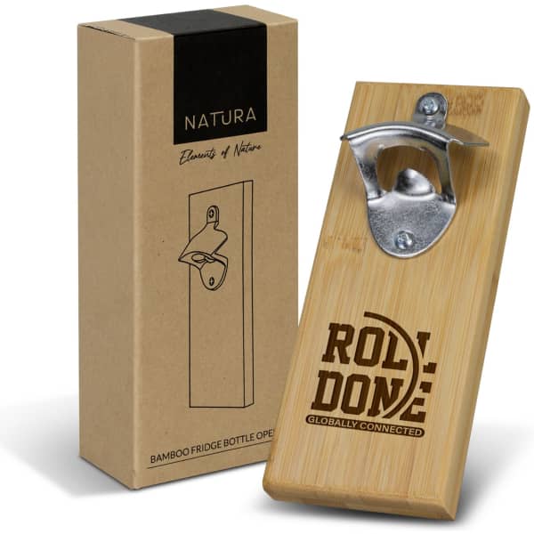 A drink bottle opener made from bamboo with a metal cap remover, displayed next to a cardboard box featuring a logo.