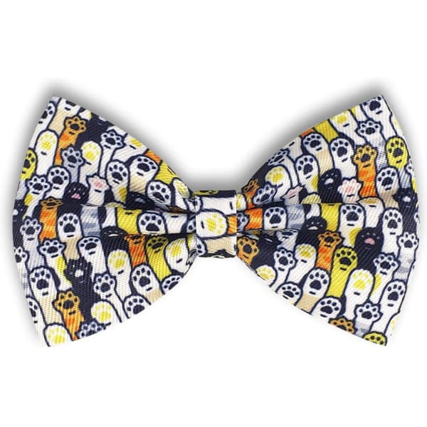 A bow tie featuring a pattern of colourful ghosts on a white background with black accents. The product has a logo.