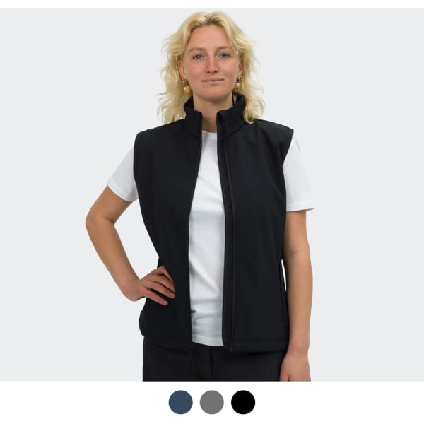 A woman wearing a black vest with a high collar, paired with a white t-shirt. The vest features a logo.