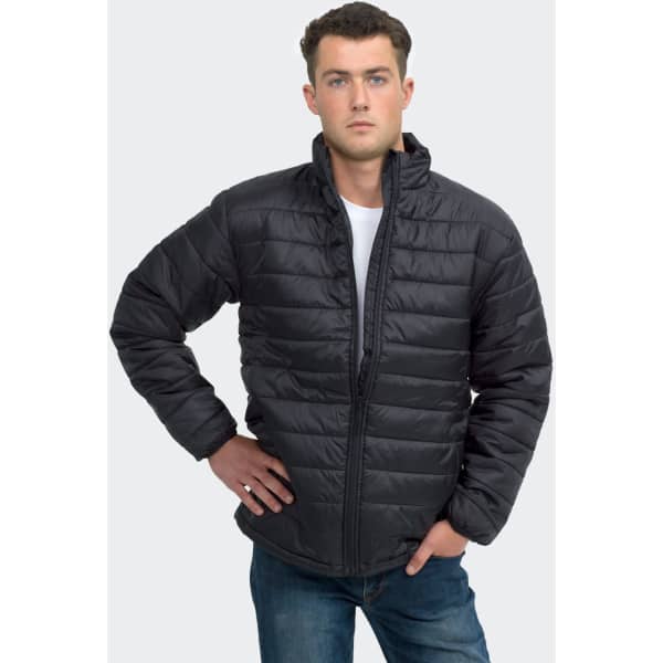 A unisex black puffer jacket with a zip closure and a stand collar, modelled by a man. Features a logo.