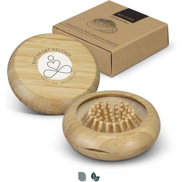 A bamboo brush and mirror set in a natural wood finish, presented in a brown cardboard box with a logo.