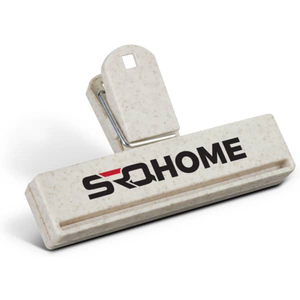 A cream snack bag clip with a logo, featuring a sturdy grip and a wide opening for securing bags.