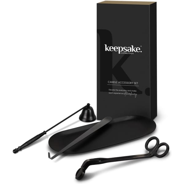 A candle accessory set featuring a black candle snuffer, wick trimmer, and dipper, presented in a sleek black box.
