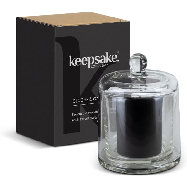 A glass candle in a cloche with a black candle inside, paired with a stylish box, featuring a logo.
