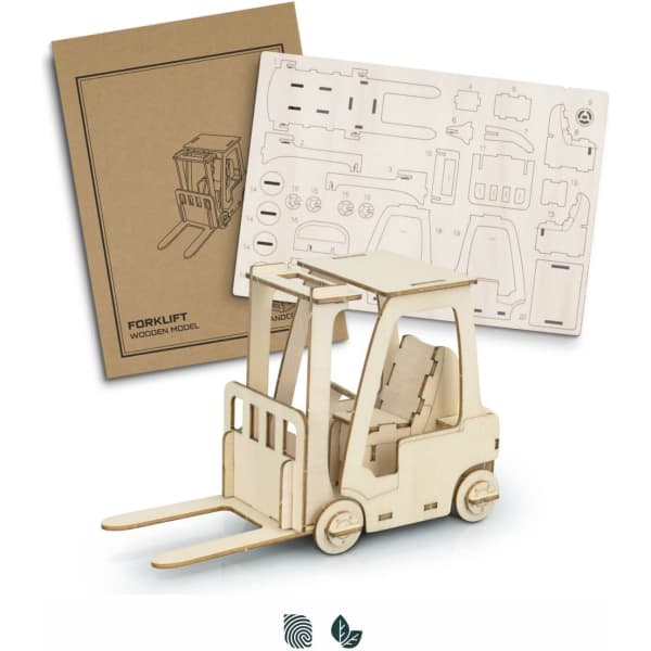 A wooden model of a forklift in natural wood colour, accompanied by a flat pack of model pieces.