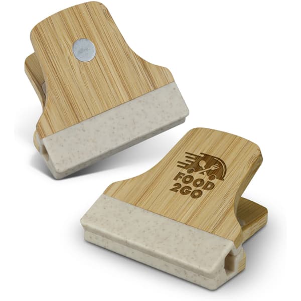 A bamboo clip with a beige section at the bottom, featuring a logo on one side.