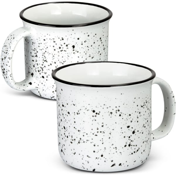 A ceramic mug with a speckled white design and a black rim, featuring a handle and a simple shape.