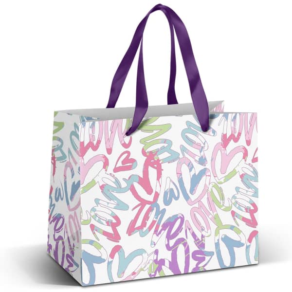 A medium paper bag with a multi-coloured heart and swirl design, featuring purple ribbon handles.