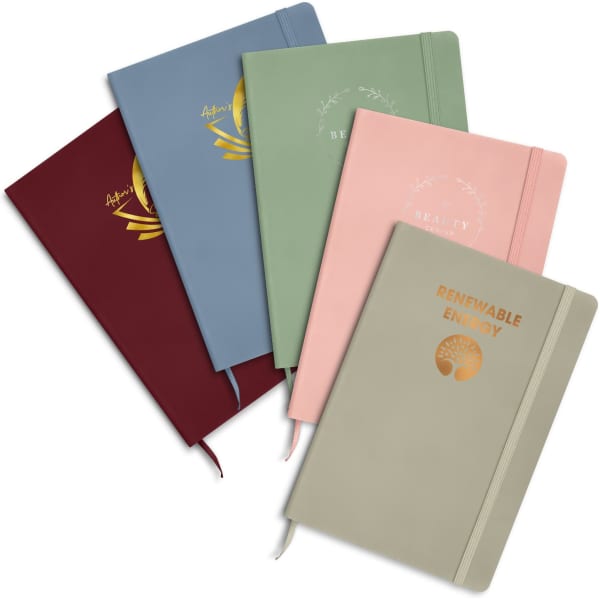 A collection of five notebooks in various colours: blue, green, pink, burgundy, and beige, each with foil printing and a logo.