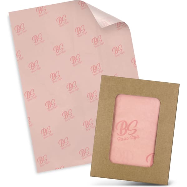Tissue paper in pale pink featuring a logo, packaged with a matching envelope in a brown cardboard frame.