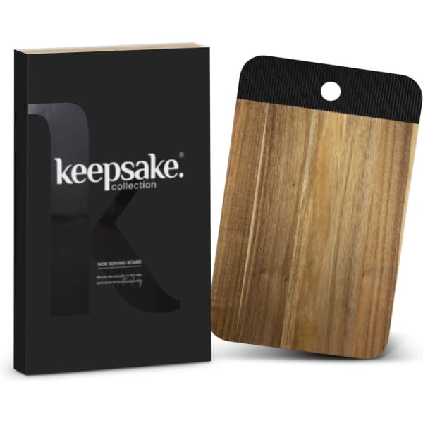 A wooden serving board with a black handle, presented in a sleek black packaging with a logo.