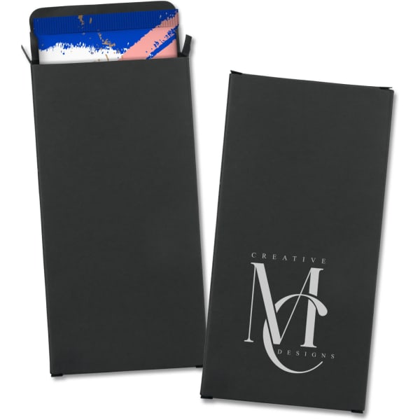 A small black gift box featuring a logo, containing assorted chocolates with a colourful wrapper visible.