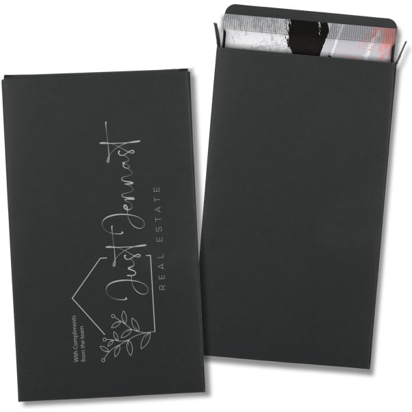 A large black gift box containing assorted chocolate treats, featuring a sleek, elegant design and branding.