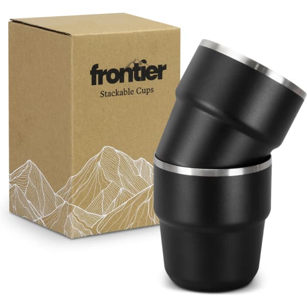 A set of two black stackable cups with a silver rim, accompanied by a kraft box featuring a logo.