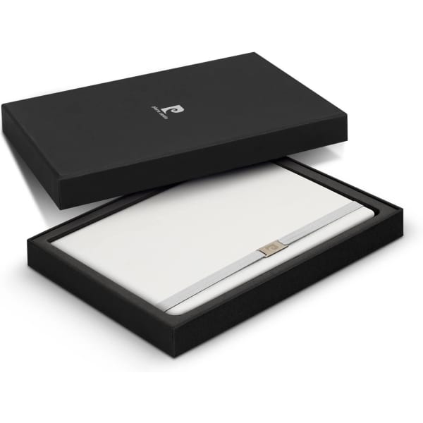 A black gift box containing a sleek white notebook with a silver band, featuring a logo.