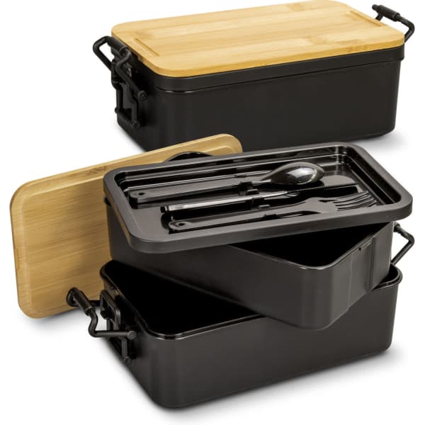 An expandable lunch box in black with a bamboo lid, featuring compartments and utensils inside.