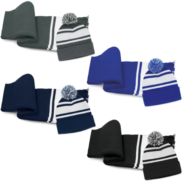 A scarf and beanie set in grey, blue, navy, and black with pom poms and contrasting stripes. Each pair has a logo.