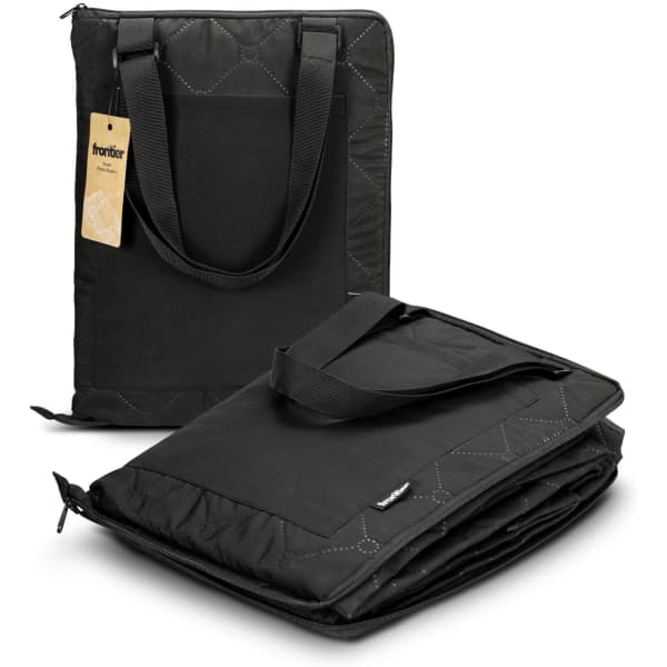 A black picnic blanket with a quilted pattern, featuring sturdy carry handles and a branding logo.
