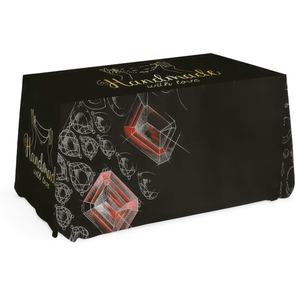 A small throw tablecloth in black featuring a geometric design and a branding logo.