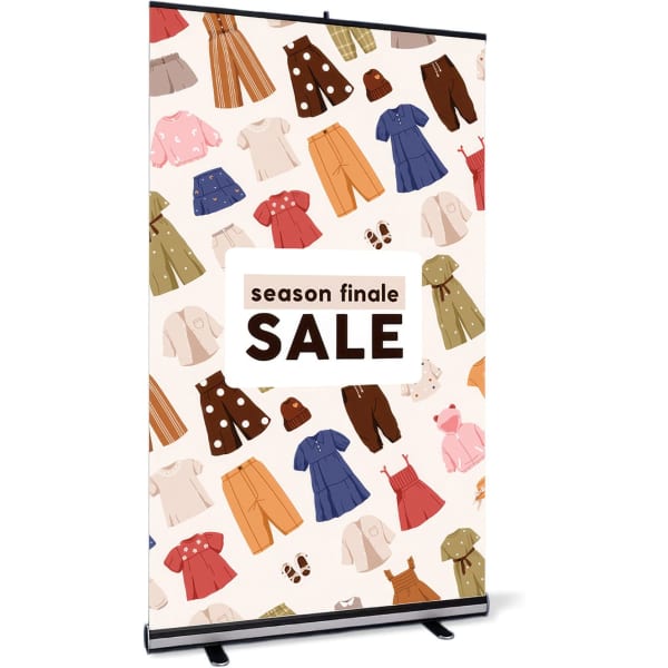 A pull-up banner stand featuring a pattern of colourful clothing items on a light background, with a logo at the top.