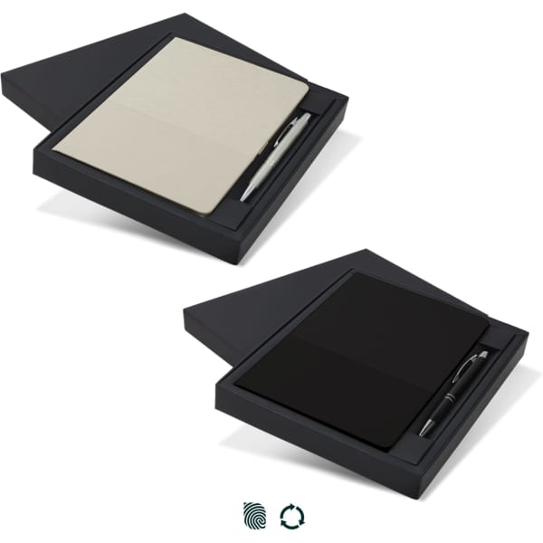 A notebook and pen gift set in a dark box, featuring a cream-coloured notebook and a black pen.