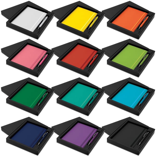 A gift set featuring notebooks and pens in various colours, arranged in black boxes. Each set has a different colour combination.