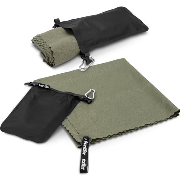 A green towel neatly folded, accompanied by a black carrying pouch and a clip, featuring a logo.