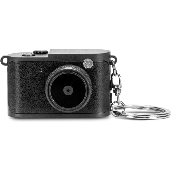 A mini camera in black with a textured finish, featuring a keyring attachment and a single lens.