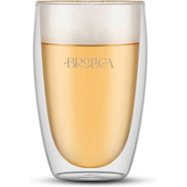 A large double wall glass, featuring a transparent design with a frosty-like finish, containing a light beverage.