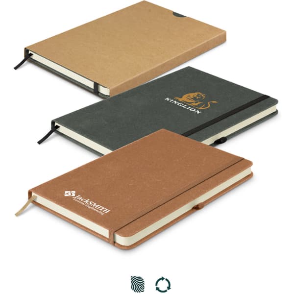 A set of three recycled hard cover notebooks in brown, green, and tan, each with an elastic band and a logo.