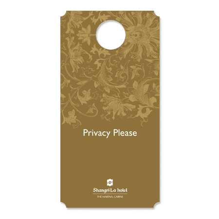 A polyprop door hanger in a gold hue with a floral design and a central circular cutout. It features a logo at the bottom.