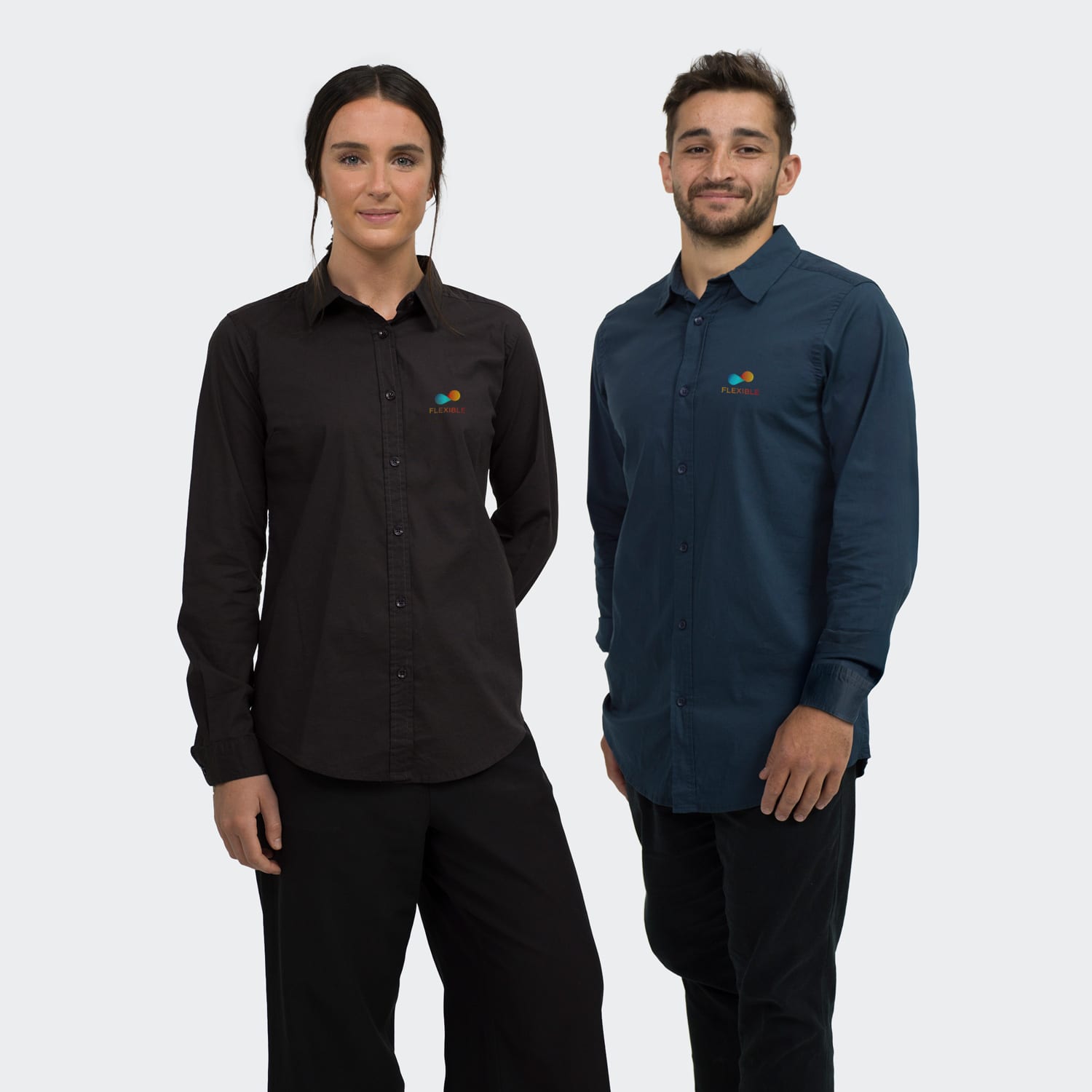 A women's black poplin button-up shirt and a men's navy blue button-up shirt, both with a logo.