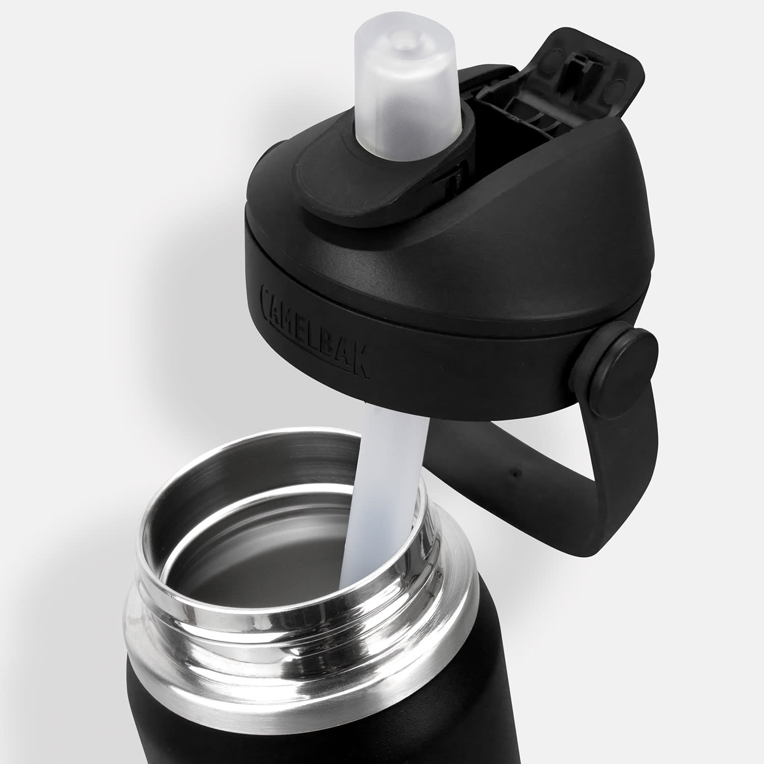 A drink bottle in black with a flip straw and stainless steel interior, featuring a lid with a logo.