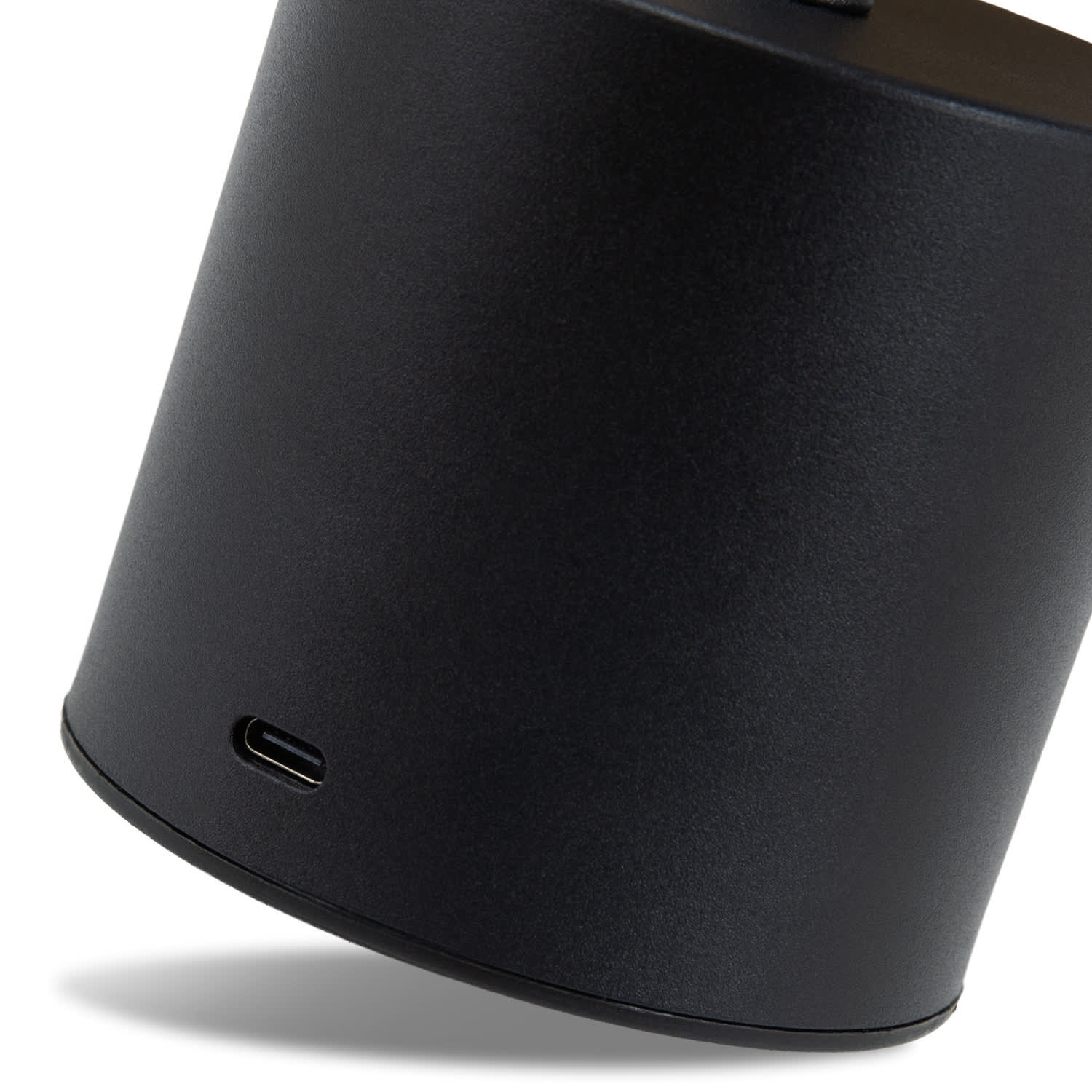 A black rechargeable table lamp with a USB-C charging port at the base, featuring a sleek cylindrical design.