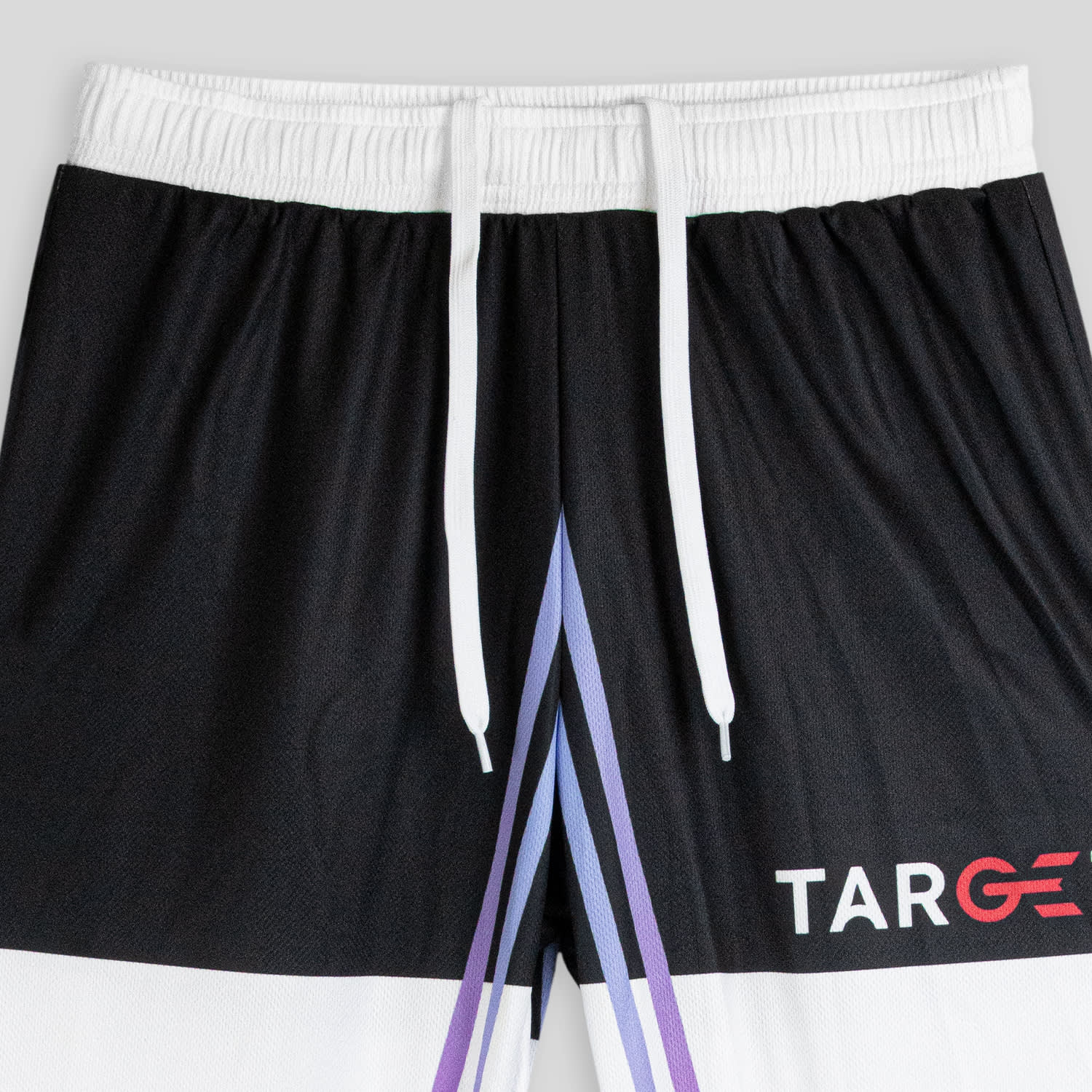 Custom women's active pants in black, featuring a white waistband and purple gradient design, with a logo.